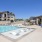 pool with lounge chairs in water